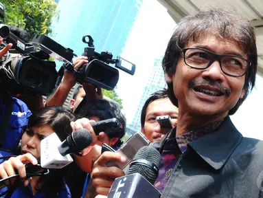   Dirjen ESDM Rida Mulya menjalani pemeriksaan di Gedung KPK, Jakarta, Jumat (12/9/2014) (Liputan6.com/Andrian M Tunay)