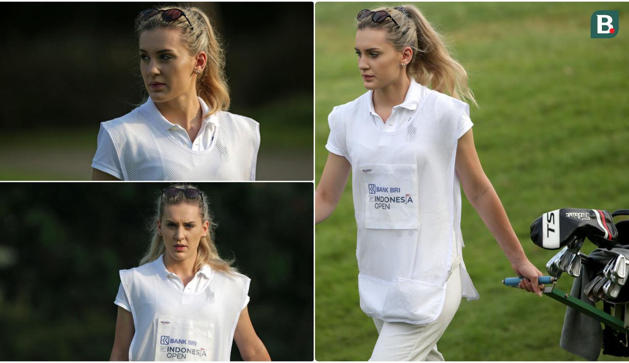 Definisi caddie menurut Wikipedia adalah the person who carries a player's bag and clubs, and gives insightful advice and moral support, almost like a coach. Di turnamen BRI Indonesia Open 2019 lalu, keberadaan caddie cantik menjadi daya tarik tersendiri. (Bola.com/Peksi Cahyo)