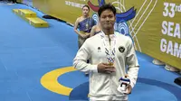 Joe Aditya Wijaya Kurniawan meraih medali perak renang nomor 100m gaya kupu-kupu putra SEA Games 2025 di Aquatic Center, Huamark Sports Complex, Bangkok. (Bola.com/Muhammad Adiyaksa)