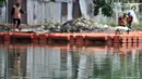 Kondisi Waduk Ciracas yang bebas sampah usai dibersihkan petugas dari UPK Badan Air Dinas Lingkungan Hidup Provinsi DKI Jakarta, Selasa (8/1). Tiap harinya, petugas mampu mengumpulkan sampah hingga 3 meter kubik. (Merdeka.com/Iqbal S Nugroho)