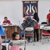 Suasana penyaluran Bantuan Langsung Tunai (BLT) Bahan Bakar Minyak (BBM) tahap tiga di Sasana Krida Karang Taruna (SKKT) Kelurahan Pondok Kopi, Kecamatan Duren Sawit, Jakarta Timur, Kamis (22/9/2022). Sebanyak 771 warga di Kecamatan Duren Sawit menerima manfaat BLT tahap tiga sebesar Rp 300 ribu sebagai kompensasi dari naiknya harga BBM. (merdeka.com/Iqbal S. Nugroho)