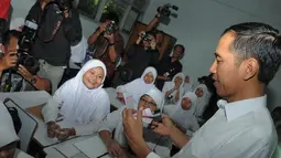 Kunjungan Jokowi ke SMPN 277 dalam rangka mengecek keberlangsungan Kartu Jakarta Pintar (KJP) di sekolah itu, Jakarta, (23/9/14). (Liputan6.com/Herman Zakharia)