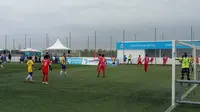 Wakil Indonesia, ASIOP Apacinti (merah) saat melawan Brasil di Danone Nations Cup (Liputan6.com / Jonathan Pandapotan)