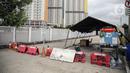 Suasana sepi di luar Rumah Sakit Darurat COVID-19 (RSDC) Wisma Atlet, Jakarta, Minggu (25/12/2022). Pemerintah menghentikan operasional Wisma Atlet Kemayoran sebagai Rumah Sakit Darurat COVID-19 mulai akhir tahun ini seiring dengan semakin rendahnya kasus COVID-19 secara nasional dalam beberapa waktu terakhir. (Liputan6.com/Faizal Fanani)