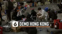Ratusan demonstran Hong Kong terus bertahan di Universitas Politeknik hari Minggu (18/11). Setelah bentrok dengan polisi, sebagian demonstran kembali siapkan bom molotov.