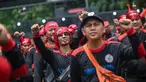Para pekerja Indonesia ikut serta dalam aksi unjuk rasa untuk mencabut UU Cipta Kerja dan menuntut upah yang lebih tinggi di Jakarta pada 24 Oktober 2024. (JUNI KRISWANTO/AFP)