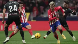 Gol tunggal Antoine Griezmann pada menit ke-64 sukses memastikan Atleti meraih tiga poin di depan pendukungnya. (Thomas COEX / AFP)