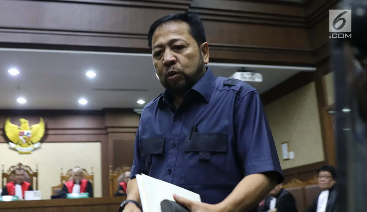 Terpidana korupsi e-KTP, Setya Novanto usai menjadi saksi dalam kasus dugaan suap proyek PLTU Riau-1 dengan terdakwa, Sofyan Basir yang juga mantan Dirut PLN di Pengadilan Tipikor, Jakarta, Senin (12/8/2019). Sidang mendengar keterangan saksi. (Liputan6.com/Helmi Fithriansyah)