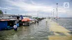 Kondisi banjir rob di kawasan Muara Angke, Jakarta, Selasa (9/11/2021). Badan Penanggulangan Bencana Daerah (BPBD) DKI Jakarta memperkirakan puncak musim hujan dan potensi rob di Ibu Kota terjadi pada Januari hingga Februari 2022. (Liputan6.com/Faizal Fanani)