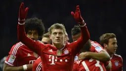 Toni Kroos. Ia hampir berseragam Manchester United usai kontraknya di Bayern Munchen akan habis di akhir musim 2013/2014. Manajer Setan Merah saat itu, David Moyes telah mencapai kata sepakat untuk memboyongnya. Sayang, Moyes keburu dipecat dan digantikan Louis van Gaal. (AFP/Odd Andersen)