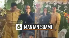 Terlihat seorang perempuan yang mengenakan kerudung menangis dan memeluk mempelai laki-laki yang berada di pelaminan.