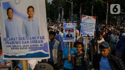 Peserta aksi juga terlihat membawa poster yang berisi ajakan untuk menolak pelbagai ujaran kebencian di akhir masa jabatan Jokowi-Ma'ruf Amin. (Liputan6.com/Angga Yuniar)