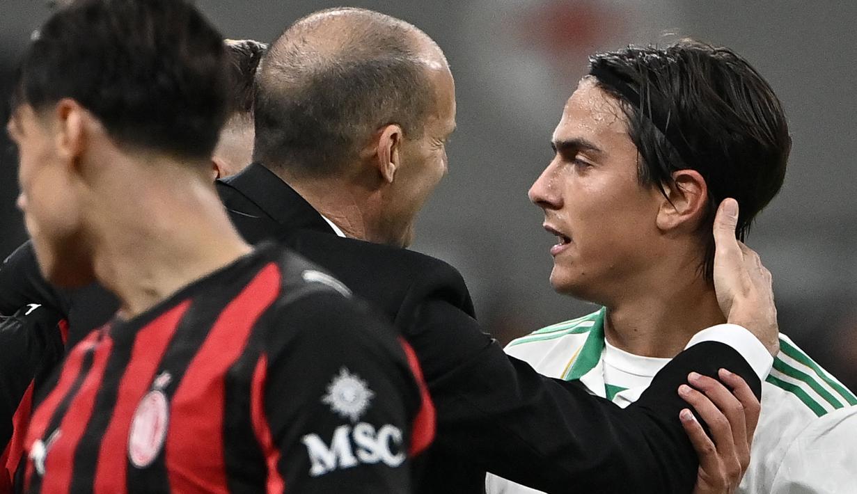 Sayangnya, Paulo Dybala yang ditunjuk sebagai algojo digagalkan kiper AC Milan, Mike Maignan. (AFP/Isabella Bonotto)