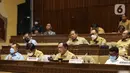 Mendagri Tito Karnavian saat mengikuti rapat kerja di Kompleks Parlemen MPR/DPR-DPD, Senayan, Jakarta, Selasa (21/6/2022). Rapat membahas Pembentukan Provinsi Papua Selatan, Pembentukan Provinsi Papua Tengah, Pembentukan Provinsi Papua Pegunungan Tengah. (Liputan6.com/Angga Yuniar)