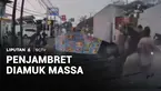 Ada dua pengendara sepeda motor menjambret telepon genggam milik wanita pejalan kaki di Kalideres, Jakarta Barat. Satu orang tertangkap menjadi bulan-bulanan warga.