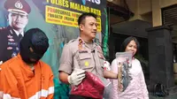 Pelaku persetubuhan anak di bawah umur digelandang ke Polres Malang Kota (Zainul Arifin/Liputan6.com)