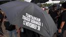 Aksi Kamisan ke-378 bertajuk Kado Kelabu dari Pemerintahan Baru di Hari HAM Internasional digelar di seberang Istana Negara, Jakarta, Kamis (11/12/2014). (Liputan6.com/Miftahul Hayat)