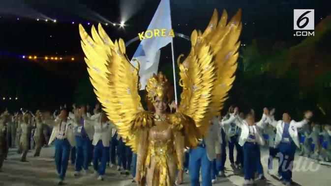 Pembukaan Asian Games, Kontingen Korea Selatan dan Utara berbaris dalam naungan bendera yang sama: Bendera Unifikasi (Liputan6)