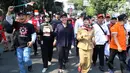Ketua Umum KPRI Rieke Diah Pitaloka bersama ribuan buruh turun ke jalan saat menggelar karnaval dan deklarasi dalam peringatan Hari Buruh Sedunia, Jakarta, Selasa (1/5). (Liputan6.com/JohanTallo)