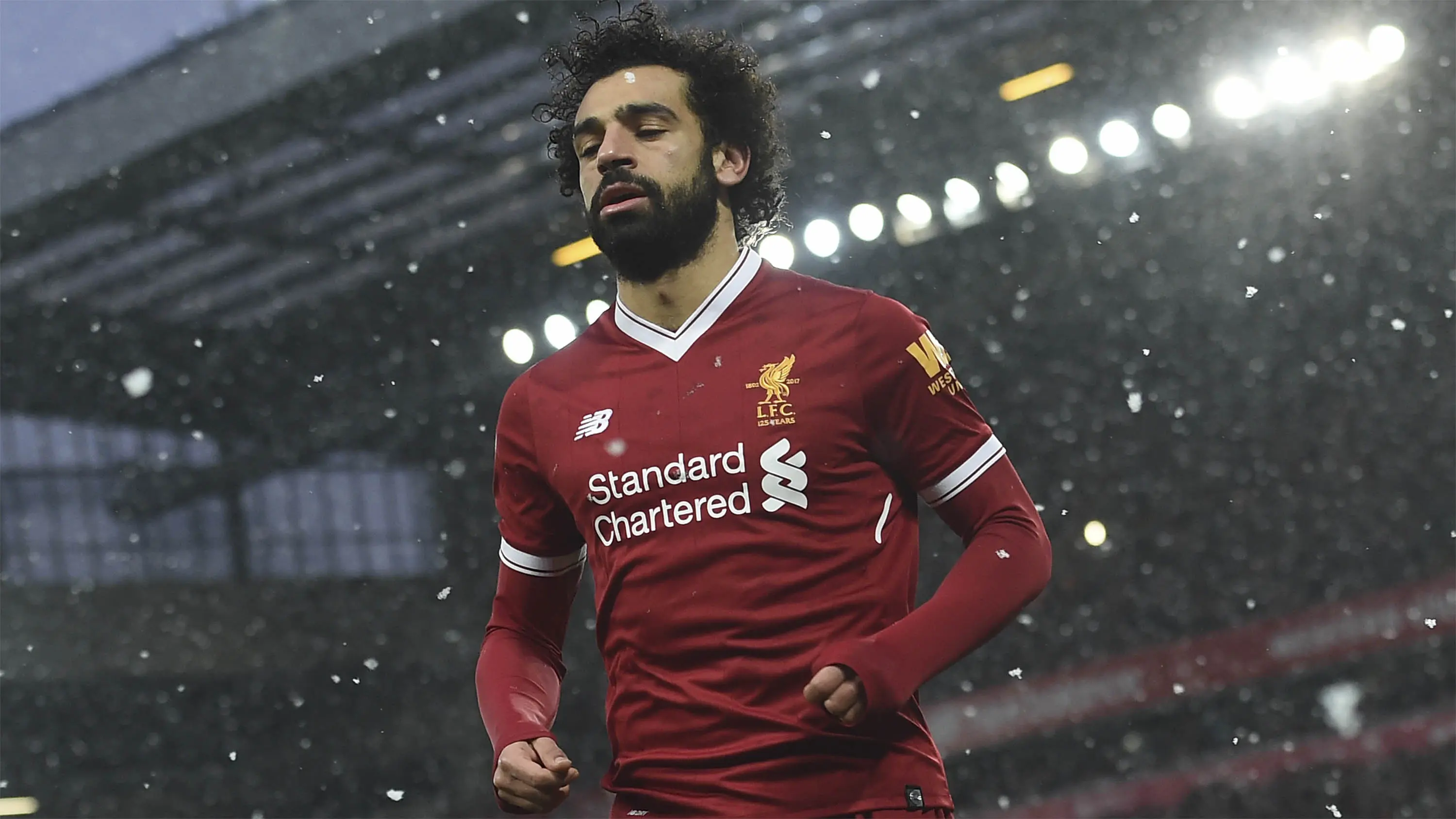 Mohamed Salah (Liverpool) - 13 Gol. (AFP/Paul Ellis)