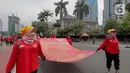 Massa buruh yang tergabung dalam Gerakan Buruh Bersama Rakyat (GEBRAK) menggelar demo di kawasan di Patung Kuda, Jakarta Pusat, Kamis (20/10/2022). Massa Gebrak juga menuntut beberapa hal yakni pencabutan Omnibus Law UU Cipta Kerja, pembatalan revisi UU P3 dan RKUHP, pembatalan revisi UU Sisdiknas serta setop tindakan represifitas aparat terhadap warga sipil. (Liputan6.com/Faizal Fanani)