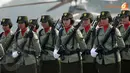 Ketegasan juga terpancar dari wajah anggota Korps Wanita Angkatan Darat (Kowad) saat perayaan HUT TNI k- 68 di Lanud Halim Perdanakusuma (Liputan6.com/ Helmi Fithriansyah)