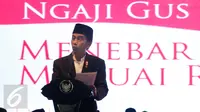 Presiden Jokowi saat memberikan sambutan pada acara Haul Gus Dur ke 7 dan Peringatan Maulid Nabi Muhammad SAW di Ciganjur, Jakarta, Sabtu (23/12). Haul Gusdur  mengangkat tema Ngaji Gusdur : Menebar Damai, Menuai Rahmat. (Liputan6.com/Gempur M Surya)