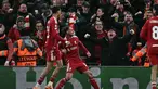 Gelandang Liverpool asal Argentina, Alexis Mac Allister (tengah) merayakan golnya dalam pertandingan pekan keempat Liga Champions 2025-2026 melawan Real Madrid di Stadion Anfield, Inggris, pada Selasa 4 November 2025 waktu setempat atau Rabu (5/11/2025) dini hari WIB. Liverpool sukses meraih kemenangan penting atas Real Madrid dengan skor tipis 1-0. (Paul ELLIS/AFP)