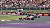 Pembalap Ferrari asal Inggris Lewis Hamilton (kiri) berkompetisi pada Grand Prix Formula Satu Hongaria di sirkuit Hungaroring di Mogyorod dekat Budapest, Hongaria, pada 3 Agustus 2025. (Attila KISBENEDEK/AFP)