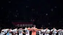 Para pemain Tottenham bersatu untuk mengheningkan cipta untuk memperingati para korban gempa bumi yang melanda Turki dan Suriah, sebelum pertandingan leg pertama babak 16 besar Liga Champions melawan AC Milan di San Siro stadion di Milan pada 15 Februari 2023. (AFP/Marco Bertorello)