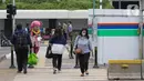Pejalan kaki menyeberang di zebra cross di kawasan Jalan Mh Thamrin, Jakarta, Rabu (25/5/2022). Kawasan Jabodetabek memberlakukan PPKM Level 1 mulai 24 Mei selama dua pekan mendatang. Selama kebijakan berlaku, karyawan di perusahaan sektor non esensial diperbolehkan bekerja dari kantor atau work from office (WFO) dengan kapasitas 100 persen. (Liputan6.com/Herman Zakharia)