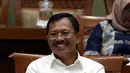 Menteri Kesehatan Terawan Agus Putranto tertawa saat rapat dengar pendapat dengan Komisi IX DPR di Kompleks Parlemen, Jakarta, Selasa (5/11/2019). Rapat membahas polemik kenaikan iuran BPJS Kesehatan. (Liputan6.com/JohanTallo)
