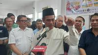 Menteri Pertanian Andi Amran Sulaiman Sidak operasi pasar yang dilakukan di Kantor Pos, Jakarta Timur. (Arief/Liputan6.com)