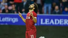 Gelandang anyar Liverpool, Mohamed Salah, berhasil mencetak gol pada laga debut ketika bersua Wigan Athletic dalam laga persahabatan, Jumat (14/7/2017). (dok. Liverpool)