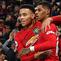 Striker Manchester United, Mason Greenwood, bersama Marcus Rashford merayakan gol ke gawang Newcastle pada laga Premier League di Stadion Old Trafford, Manchester, Rabu (26/12). MU menang 4-1 atas Newcastle. (AFP/Paul Ellis)
