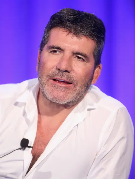 Simon Cowell merupakan sahabat dekat dari Cheryl Cole, tak hanya itu, Simon Cowell berpendapat bahwa Liam Payne adalah sosok pria pendamping yang cocok untuk Cheryl. (AFP/Bintang.com)