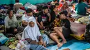 Tercatat, ada sekitar 934 warga mengungsi akibat tanah longsor di Dusun Situkung, Pandanarum, Banjarnegara. Mereka mengaku belum tahu sampai kapan tinggal di pengungsian. Tampak dalam foto, warga saat berada di lokasi pengungsian pasca longsor di Desa Situkung, Banjarnegara, Jawa Tengah, pada Kamis 20 November 2025. (DEVI RAHMAN/AFP)