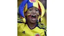 Salah satu pendukung cilik "Los Cafeteros" berteriak saat menyaksikan laga Kolombia kontra Yunani di Belo Horizontale, Brasil, (14/6/2014). (AFP PHOTO/Eitan Abramovich)
