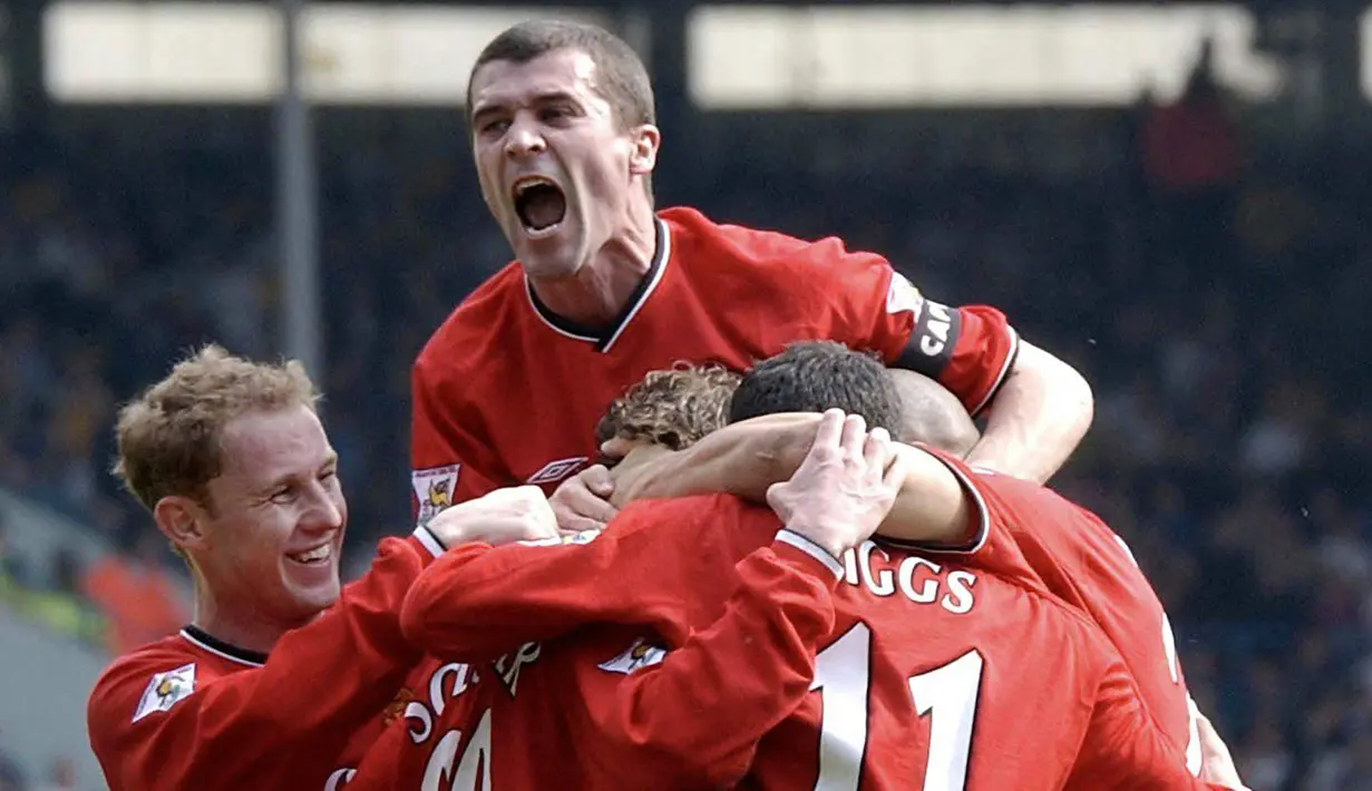 Roy Keane (atas) merupakan kapten tersukses dalam sejarah Manchester United. Di bawah kepemimpinannya, Setan Merah mampu meraih sembilan gelar Liga Inggris dan satu trable kontinental di musim perdananya menjadi kapten pada 1998/1999. (AFP/Paul barker)