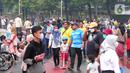 Warga berolahraga saat CFD di kawasan Bundaran HI, Jakarta, Minggu (3/7/2022). Meski sempat diguyur hujan tidak menyurutkan  masyarak untuk berolahraga di akhir pekan. (Liputan6.com/Angga Yuniar)