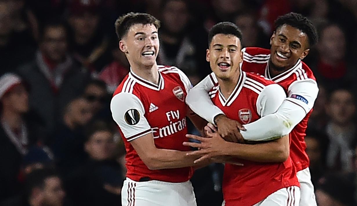 Para pemain Arsenal merayakan gol yang dicetak Gabriel Martinelli ke gawang Standard Liege pada laga Liga Europa di Stadion Emirates, London, Kamis (3/10). Arsenal menang 4-0 atas Liege. (AFP/Glyn Kirk)