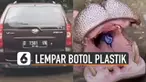Direkam oleh pengendara mobil dibelakangnya, pengunjung lempar botol plastik ke dalam mulut kudanil.