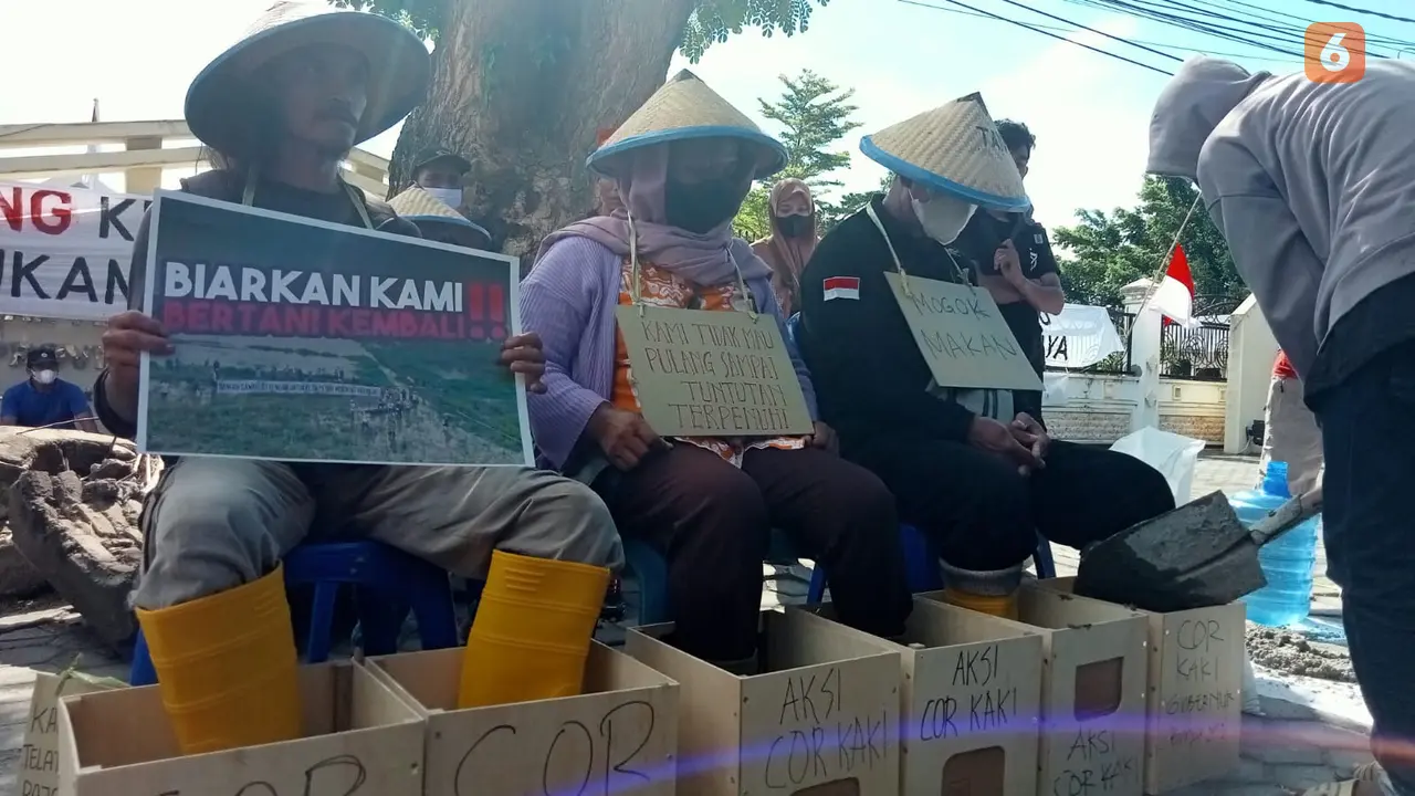 aksi mengecor kaki petani poso terdampak PLTA Poso