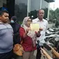 Warga melaporkan Bripka Madih ke Polda Metro Jaya, Senin (6/2/2023).(Liputan6.com/ Ady Anugrahadi)