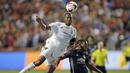 Bek Real Salt Lake, Chris Schuler, duel udara dengan striker Manchester United, Anthony Martial, pada laga persahabatan di Stadion Rio Tinto, Utah, Selasa (17/7/2017). MU menang 2-1 atas Salt Lake. (AP/Rick Bowmer)