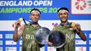 Fajar Alfian/Muhammad Rian Ardianto unggul dua set langsung 21-16, 21-16 atas Aaron Chia/Soh Wooi Yik dari Malaysia. (JUSTIN TALLIS/AFP)