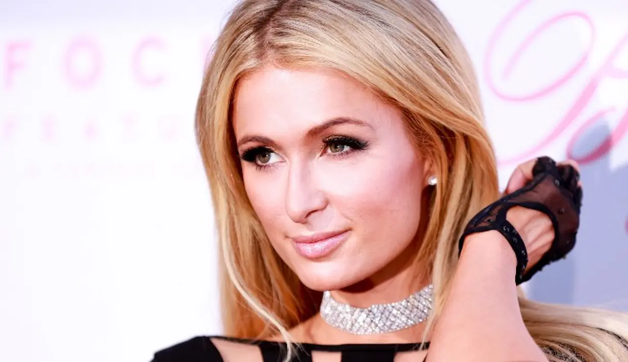 Paris Hilton bahkan tak diizinkan memasuki beberapa negara karena sering berpesta. Ia dianggap sebagai pengaruh yang buruk saat berpesta. (RICH FURY  GETTY IMAGES NORTH AMERICA  AFP)