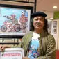 Ashady, pemenang Astra International Cartoon Contest, dan karyanya (Foto: Istimewa). 