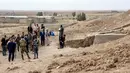Didirikan di pintu masuk kota kuno Khorsabad, sekitar 15 kilometer (10 mil) utara kota modern Mosul, patung tersebut menunjukkan Lamassu, Dewa Asyur dengan kepala manusia, tubuh banteng, dan sayap burung. (Zaid AL-OBEIDI / AFP)