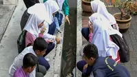 Sekolah di Ipoh, Perak, Malaysia, budi dayakan ikan di selokan sekolah. (dok. GPS Bestari)